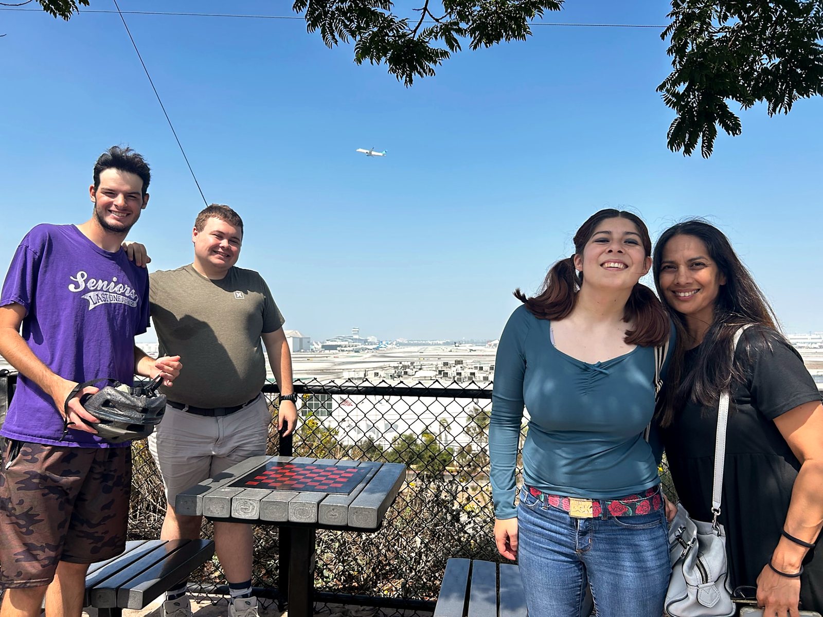 Participants and team members together at an outdoor overlook on a clear day